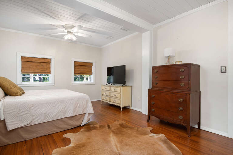 Wake up in the room with the antique dresser and the window facing the quiet side of the house. The person who gets this bedroom always sleeps the best.