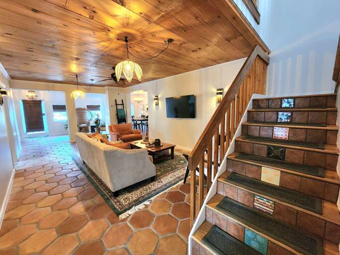 Take it all in: wood plank ceiling, terracotta tile underfoot, a room that has been gathering families for generations. The character here is not manufactured.