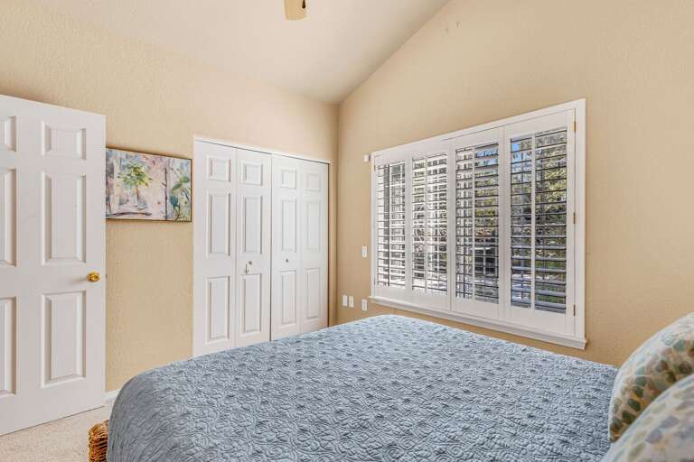 Guest Bedroom 2 - Main Level: Queen-size bed with access to a dedicated hallway bathroom. Guest Bedroom 2 - Main Level: Queen-size bed with access to a dedicated hallway bathroom.