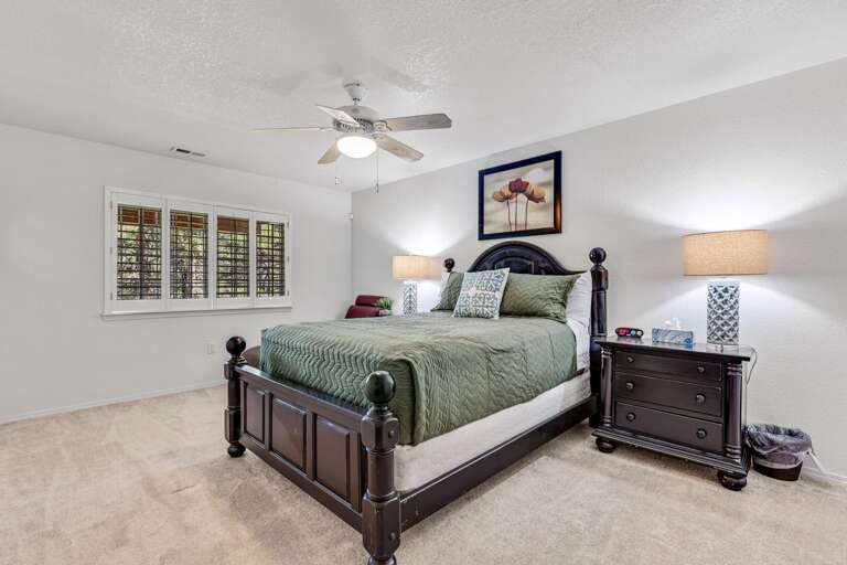 Guest Bedroom 3 - Lower Level: Queen-size bed with a cozy chaise lounge. Guest Bedroom 3 - Lower Level: Queen-size bed with a cozy chaise lounge.