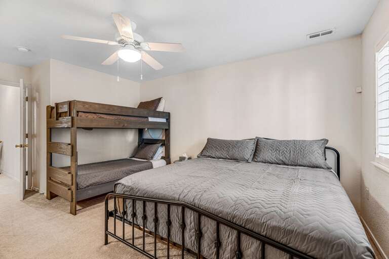 Guest Bedroom 4 - Lower Level: King-size bed and twin-over-twin bunk bed, ideal for families. Guest Bedroom 4 - Lower Level: King-size bed and twin-over-twin bunk bed, ideal for families.