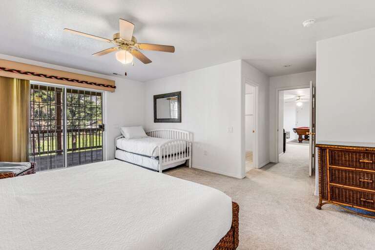 Guest Bedroom 5: King-size bed with twin trundle bed, private deck access, and attached Jack-and-Jill bathroom. Guest Bedroom 5: King-size bed with twin trundle bed, private deck access, and attached Jack-and-Jill bathroom.