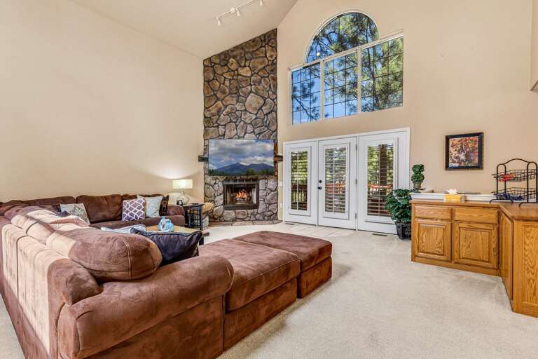 Living room with large windows and TV Living room with large windows and TV