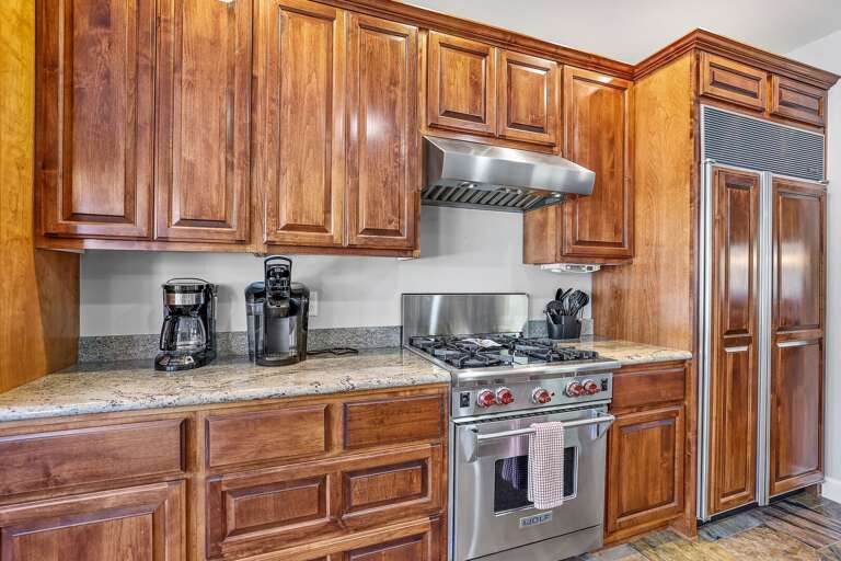 Modern appliances, including a Wolf gas range, double oven, standard and Keurig coffee machines. Modern appliances, including a Wolf gas range, double oven, standard and Keurig coffee machines.