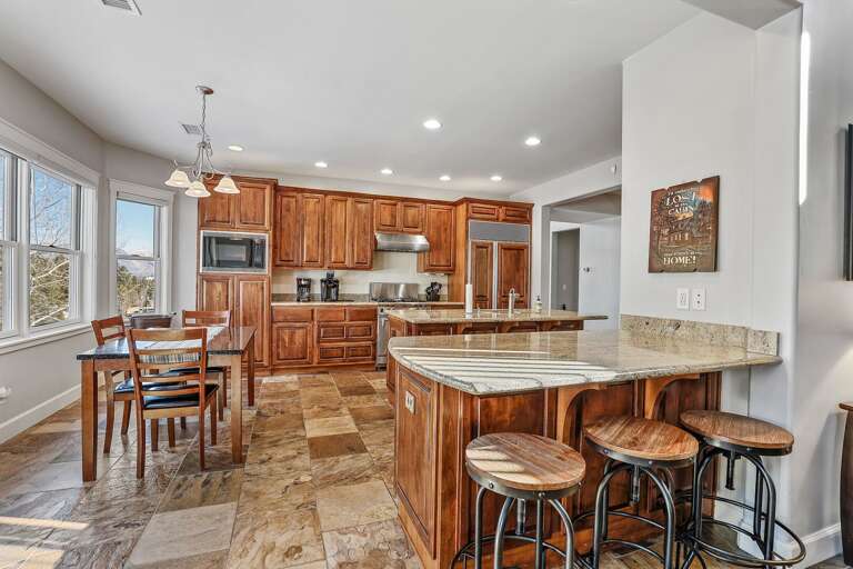 The open layout flows seamlessly into a fully equipped gourmet kitchen and elegant dining room, ideal for shared meals and lively conversations. The open layout flows seamlessly into a fully equipped gourmet kitchen and elegant dining room, ideal for shared meals and lively conversations.