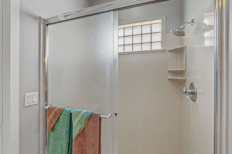Primary en-suite bathroom on the 1st Floor with a whirlpool spa, walk-in shower, double vanities, and a separate commode room. Primary en-suite bathroom on the 1st Floor with a whirlpool spa, walk-in shower, double vanities, and a separate commode room.