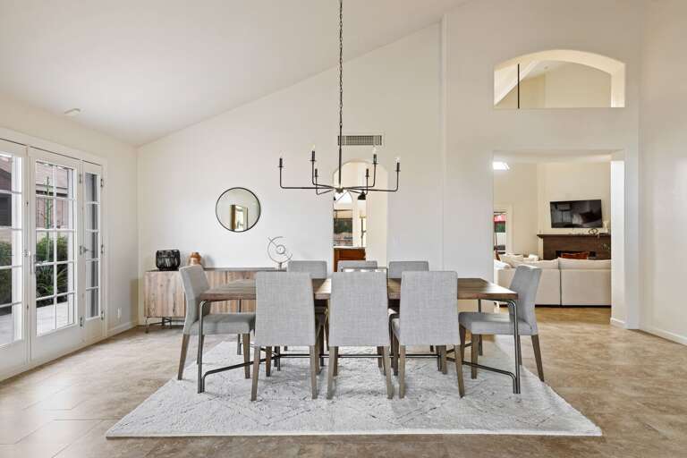 Arched entryways to the living room and kitchen.