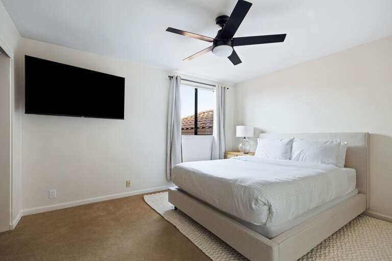 Third bedroom located upstairs with King size bed and flat screen TV.