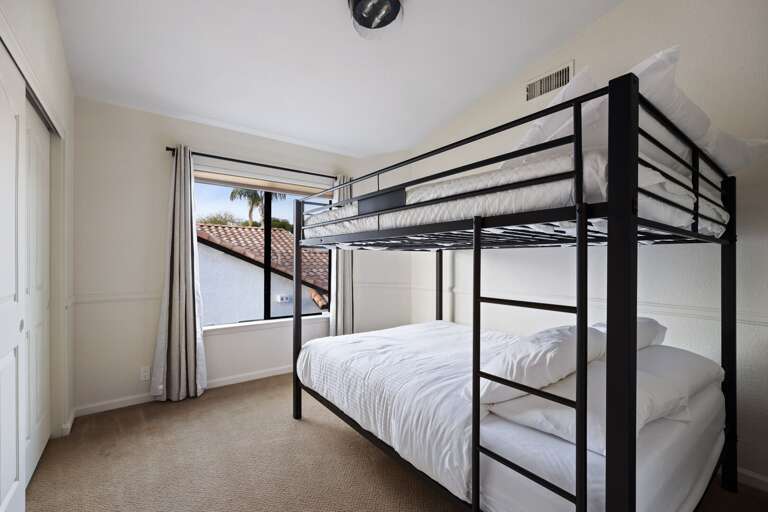 Bunk beds with Queen size mattresses.