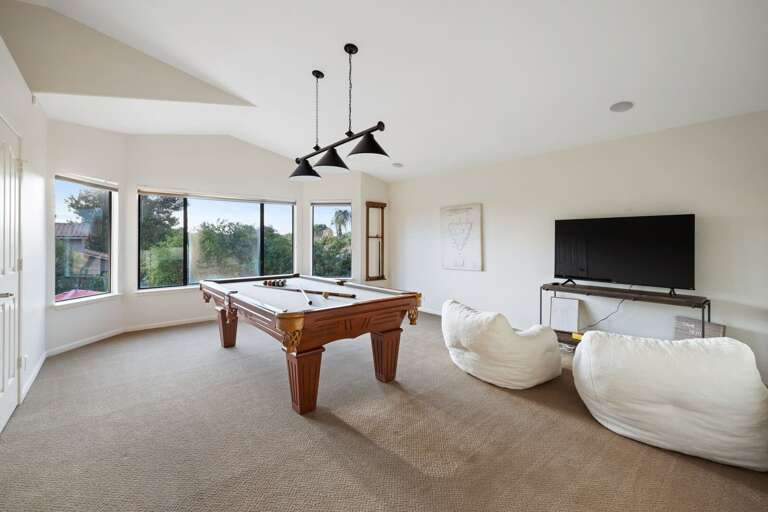 Pool table and TV for family game nights.