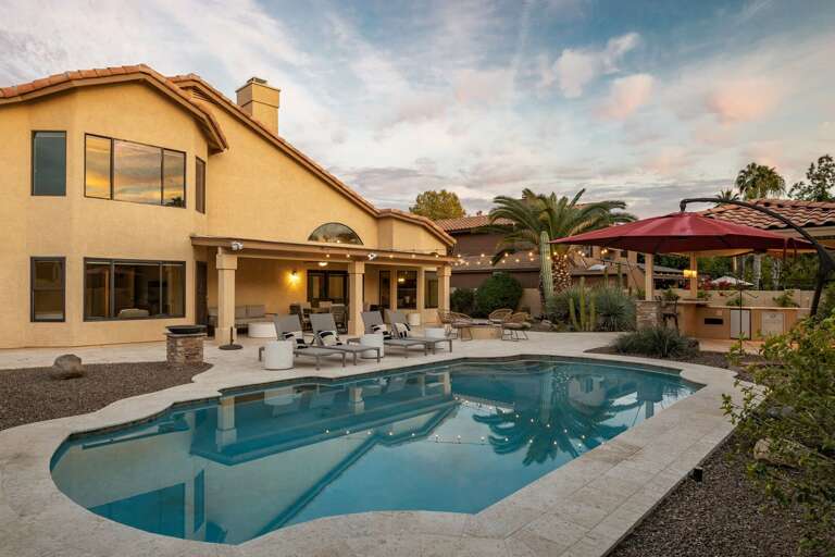 Umbrella allowing shade over the pool for the sunny days.