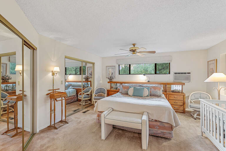 Master Bedroom - 2nd Floor: A luxurious space with a king-size bed, a crib for little ones, a TV, and an en-suite bathroom featuring a dual-sink vanity and a tub/shower combination. Master Bedroom - 2nd Floor: A luxurious space with a king-size bed, a crib for little ones, a TV, and an en-suite bathroom featuring a dual-sink vanity and a tub/shower combination.