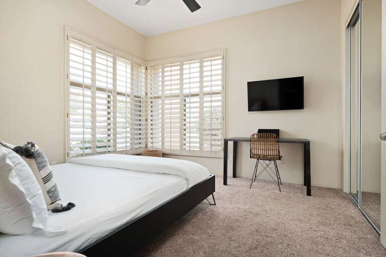 Bedroom with desk for working remotely. Bedroom with desk for working remotely.