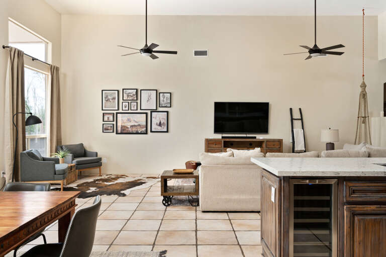 An open air living, kitchen, and dining home. An open air living, kitchen, and dining home.