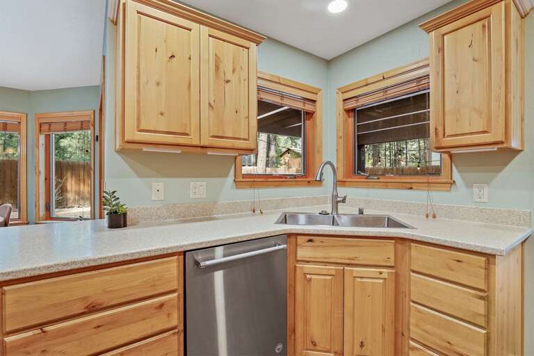 featuring stainless steel appliances, a dishwasher, and all the essentials needed for home-cooked meals featuring stainless steel appliances, a dishwasher, and all the essentials needed for home-cooked meals