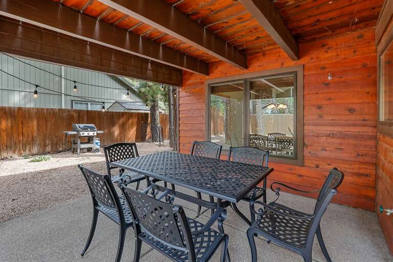 Unwind in the private fenced backyard, complete with a cozy firepit, a covered dining area, and a propane grill. Unwind in the private fenced backyard, complete with a cozy firepit, a covered dining area, and a propane grill.