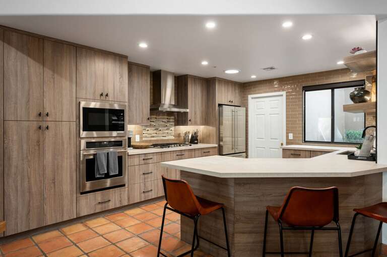 Kitchen space with washer & dryer beyond the door. Kitchen space with washer & dryer beyond the door.