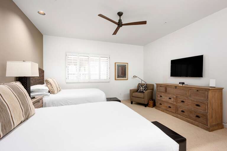 Two Queen beds with a private seating area. Two Queen beds with a private seating area.