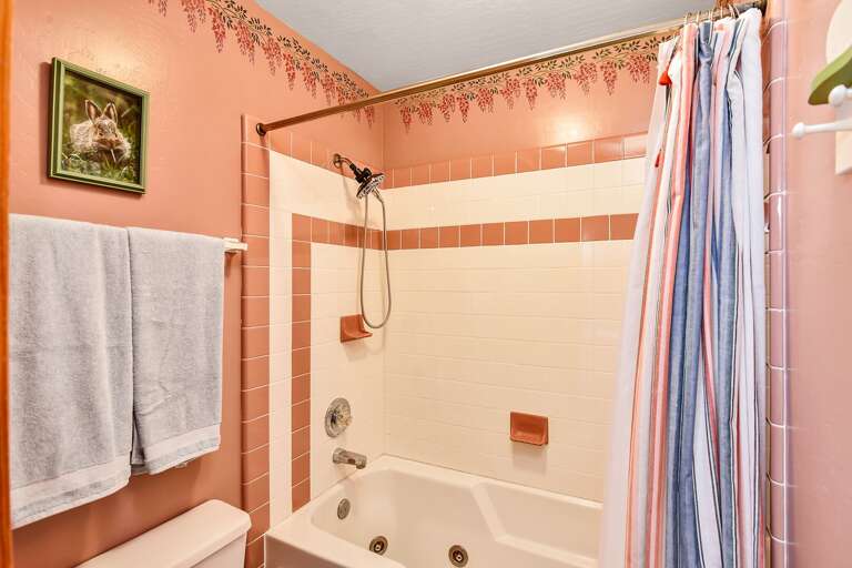 Elegant bathroom featuring both a relaxing tub and a refreshing shower, designed for ultimate comfort. Elegant bathroom featuring both a relaxing tub and a refreshing shower, designed for ultimate comfort.