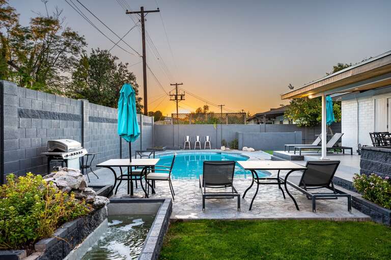 Water feature and lounging next to the pool. Water feature and lounging next to the pool.