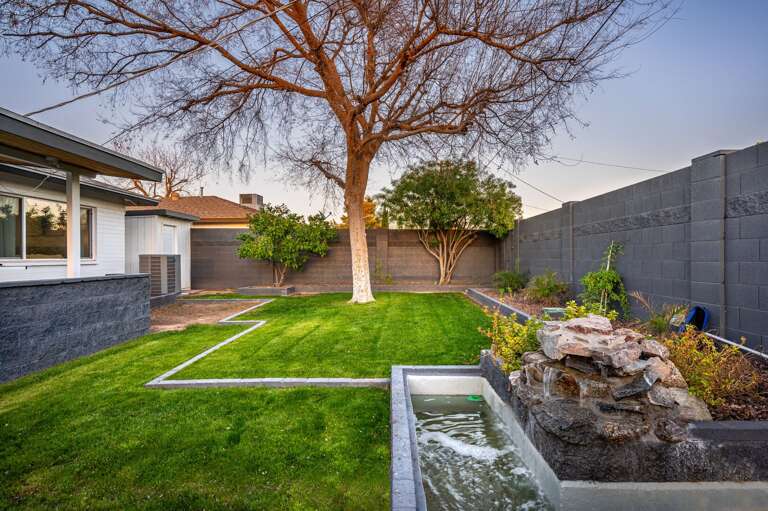 Water feature and a tree to make memories around. Water feature and a tree to make memories around.