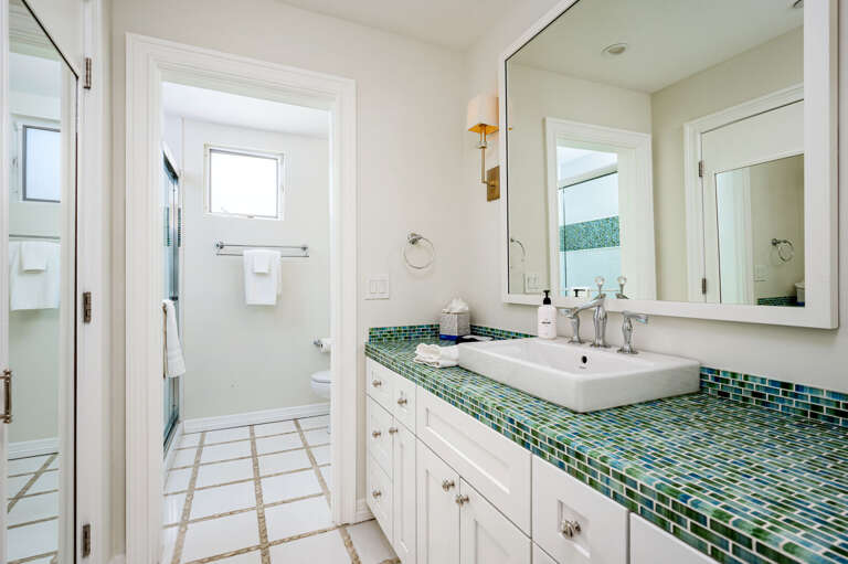 En-suite bathroom to second queen sized room.