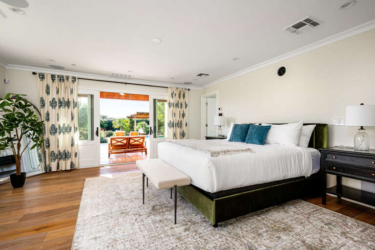 Master bedroom with private access to the backyard and en suite.