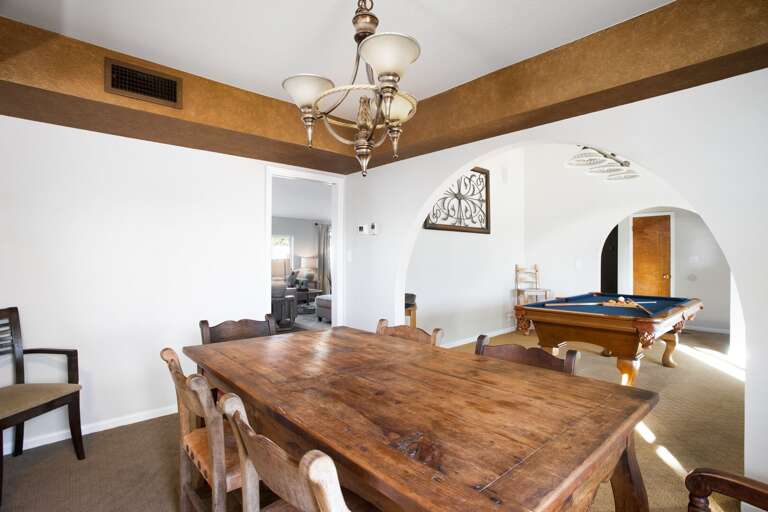 Formal Dining Area w/ Game Room in Background