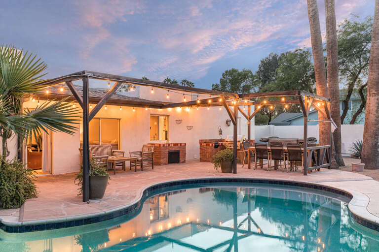 Pool Area w/ Outdoor Dining & Grill in Background