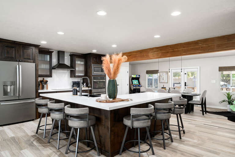 Barstool seating for 6, surrounding the kitchen island. Barstool seating for 6, surrounding the kitchen island.