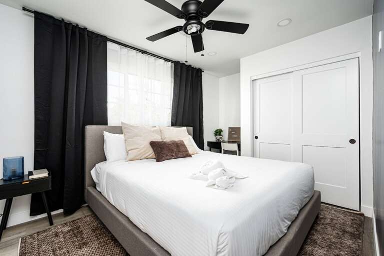 Fourth bedroom with a desk in the corner.