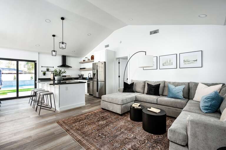 The living room, kitchen, and dining are all centralized for maximum gathering space.