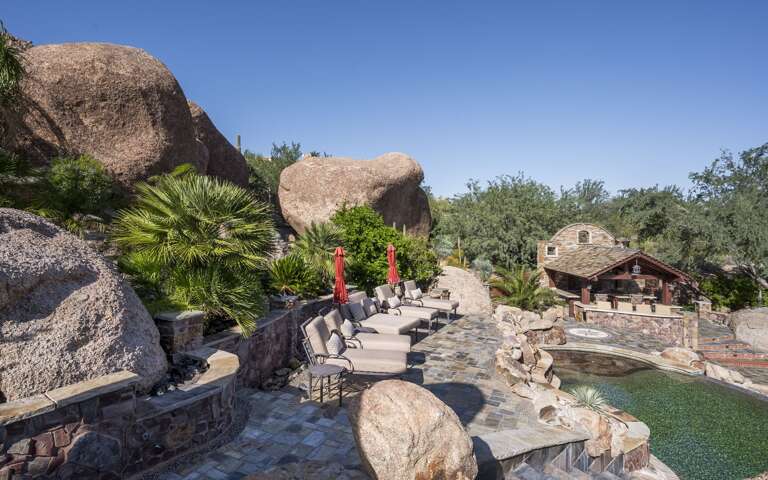 Take in the beauty of this extraordinary desert estate, complete with a private pool and waterslide.