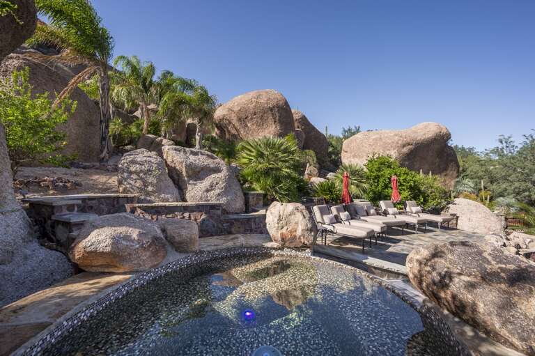 Take in the beauty of this extraordinary desert estate, complete with a private pool and waterslide.