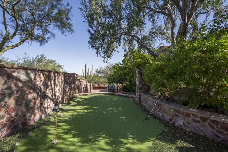 Enjoy a leisurely round of putting on the private green, surrounded by lush landscaping and beautiful desert scenery.