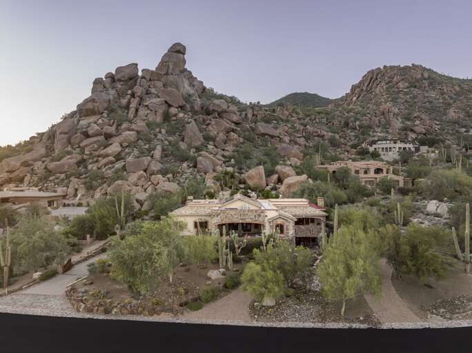 Experience the beauty of the Sonoran Desert from this magnificent estate surrounded by towering boulders and picturesque desert landscapes.