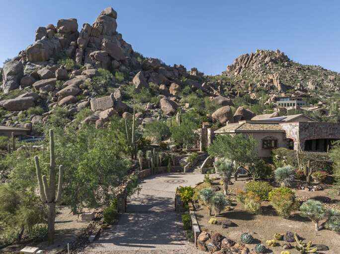 Discover a luxurious desert escape nestled among dramatic rock formations and iconic saguaro cacti.
