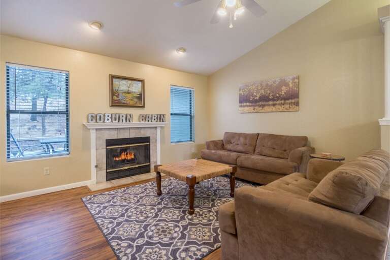 Cozy living room with a warm fireplace, perfect for relaxation and making memories.