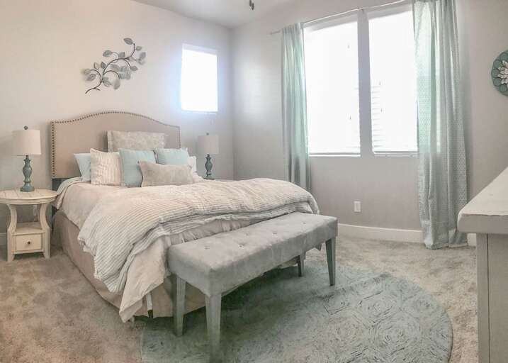 Cozy queen bed, offering the perfect blend of comfort