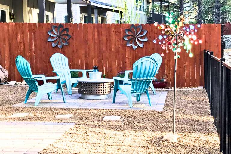 Forest Views & Outdoor Charm: Enjoy peaceful mornings or cozy nights by the firepit, surrounded by stunning pine trees directly in your backyard.