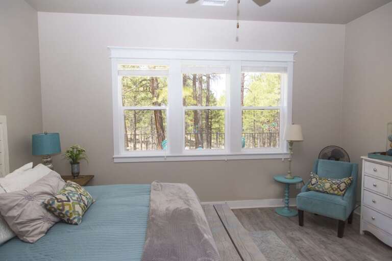 King bedroom with a cozy seating area, perfect for relaxation and unwinding.