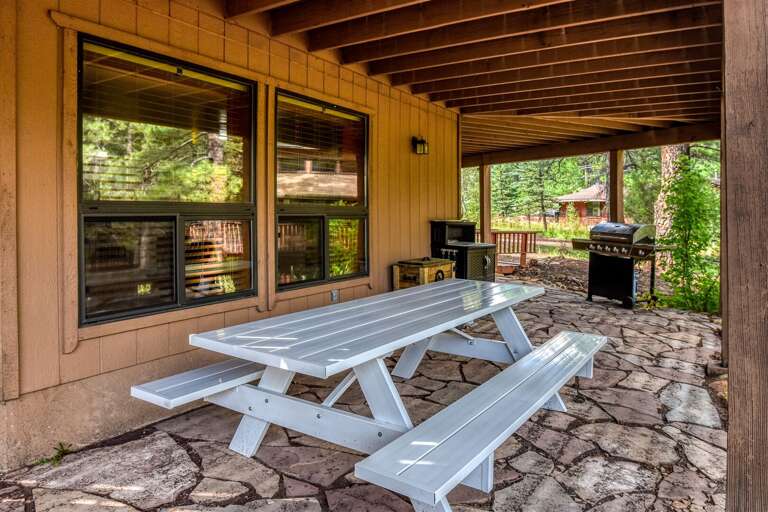 Charming outdoor dining area, perfect for enjoying meals al fresco and soaking in the fresh air.