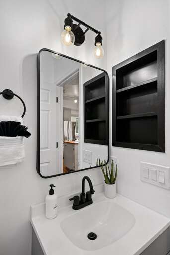 Hallway half Bathroom w/ toilet & sink Hallway half Bathroom w/ toilet & sink