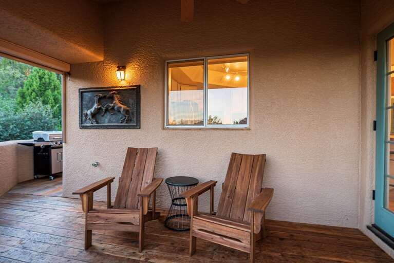 Outdoor Seating Area w/ Grill in Background Outdoor Seating Area w/ Grill in Background