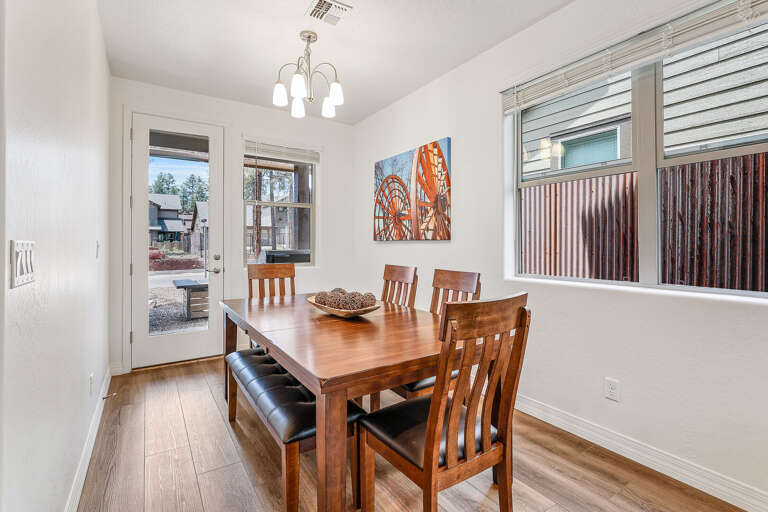 Gather around the elegant dining table, comfortably seating six. Ideal for family meals or a relaxed evening with friends, this space makes dining together a memorable experience.