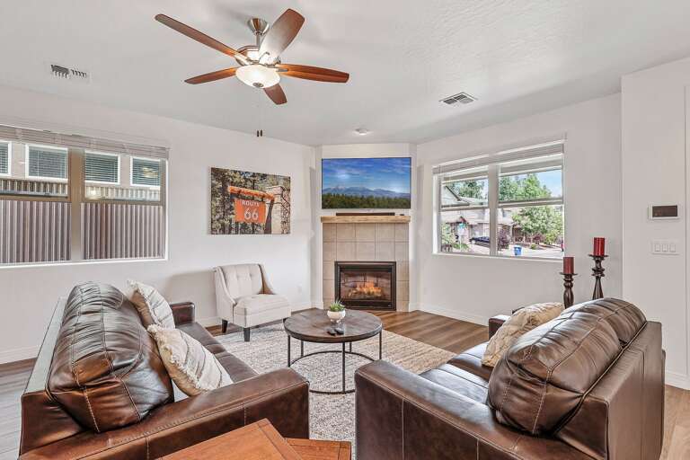 Relax and unwind in the spacious, cozy living room, complete with comfortable seating and stylish