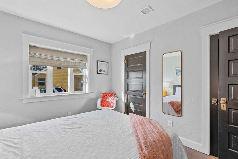 The first bedroom features a comfortable queen-size bed. The first bedroom features a comfortable queen-size bed.