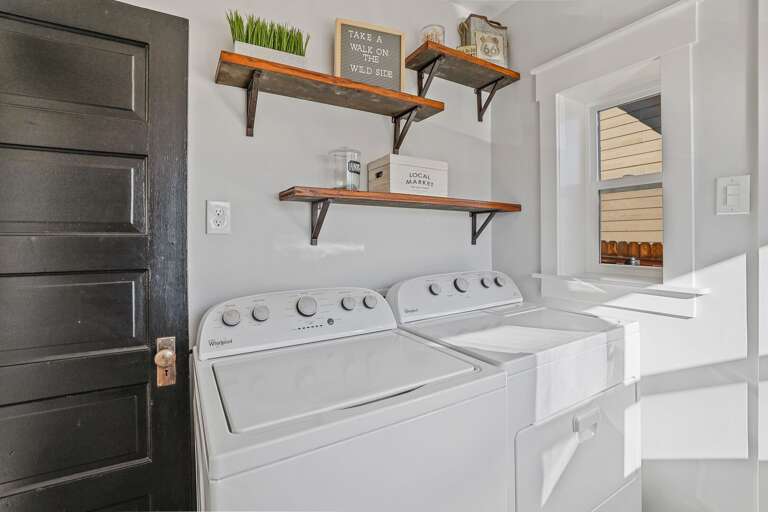 A full washer and dryer are conveniently located in a room adjacent to the kitchen, making it easy to refresh your clothes during your stay. A full washer and dryer are conveniently located in a room adjacent to the kitchen, making it easy to refresh your clothes during your stay.