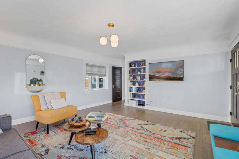 The living room is a nod to the mid-century era, with clean lines, warm wood accents, and thoughtful details that create a cozy, stylish retreat. The living room is a nod to the mid-century era, with clean lines, warm wood accents, and thoughtful details that create a cozy, stylish retreat.