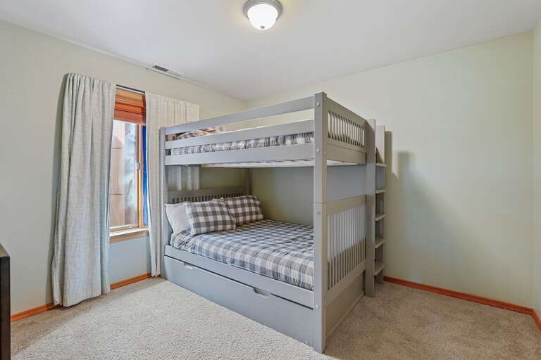 The third bedroom is perfect for families, with a bunk bed that includes two full-sized beds and a trundle. The third bedroom is perfect for families, with a bunk bed that includes two full-sized beds and a trundle.